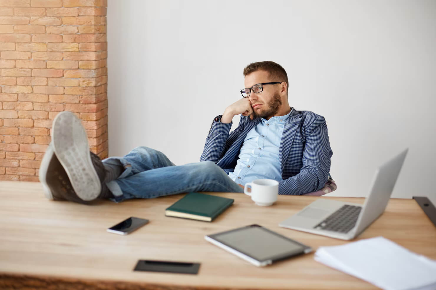 Lazy employee was hired after recruitment mistakes were made. He is not productive, he is sitting the office bored